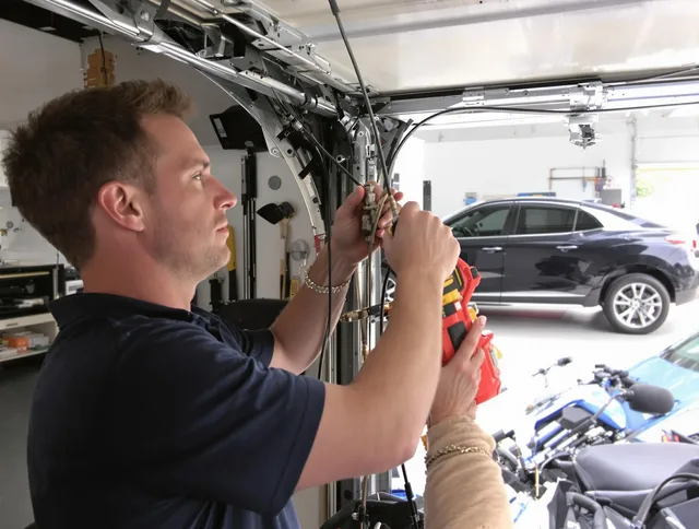 Mount Holly Garage Door Repair safety certified technician performing cable replacement in Mount Holly