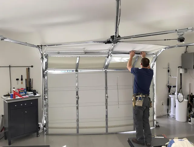 Mount Holly Garage Door Repair specialist performing precise section replacement on Mount Holly garage door